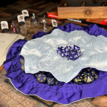 Load image into Gallery viewer, A light blue and purple dice bag sits open flat on a gaming table.